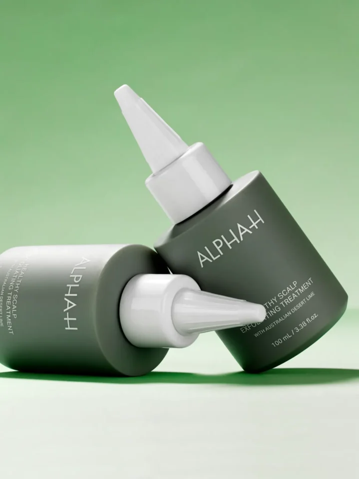 Two bottles of Alpha-H Healthy Scalp Exfoliating Treatment.