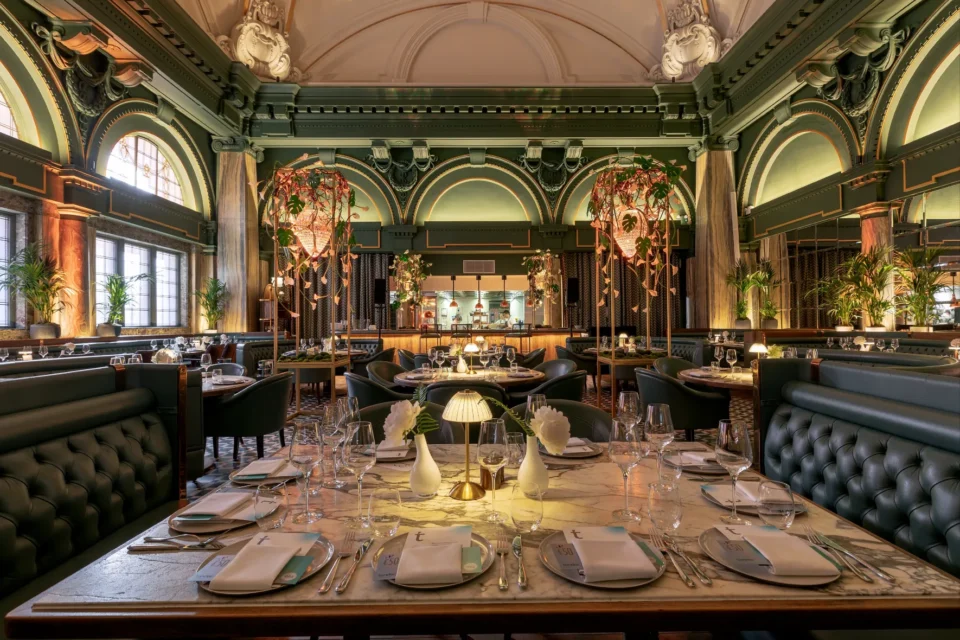 View of a restaurant's interior with tables set for a meal.