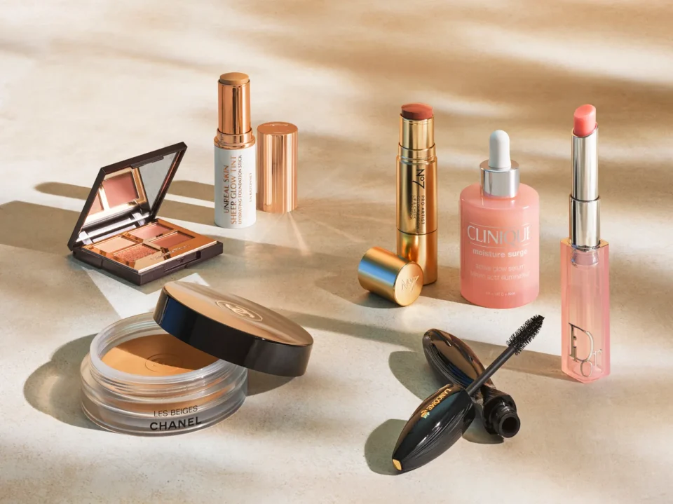 Award-winning beauty products including Clinique Moisture Surge serum, Chanel Les Beiges powder, Lancôme mascara, Dior lipstick, and more.